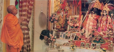 Srila Prabhupada prays to Their Lordships Sri Sri Radha Govinda at ISKCON New York City 1974