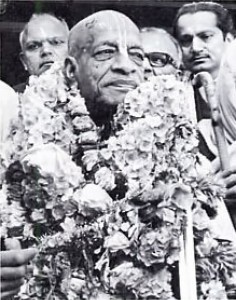 His Divine Grace A. C. Bhaktivedanta Swami Prabhupada flanked by Indian admirers. 1975.