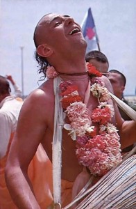Visnujana Swami Playing the Mridanga in Sankirtana. 1975.