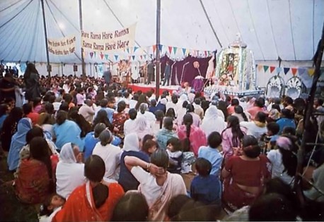 Indian guests enjoy cultural program in large tent at Bhaktivedanta Manor. 1975.