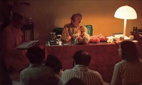 Srila Prabhupada with guests and discipels for evening study session. 1975. 