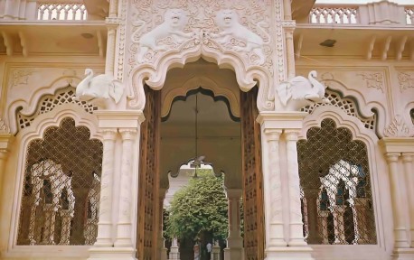 Open door reveals auspicious tamal tree, one of five in Vrindavan, around which temple is built.