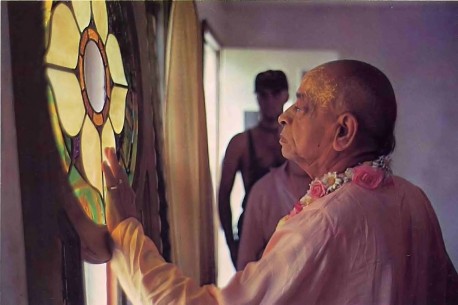 At a New Vrindavan construction site, Srila Prabhupada looks at a stained glass window. Summer Tour 1976.