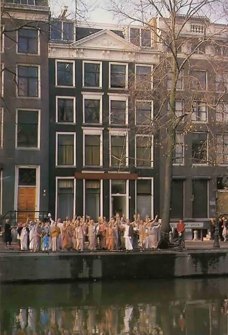 ISKCON Devotees standing before the Amsterdam center of the International Society for Krishna Consciousness. 1977