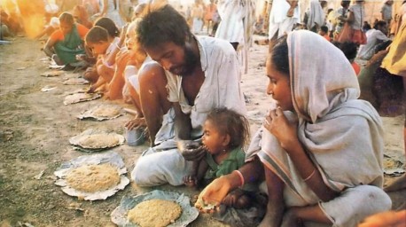 ISKCON Devotees feeding hungry people at Mayapur, West Bengal, 1977.