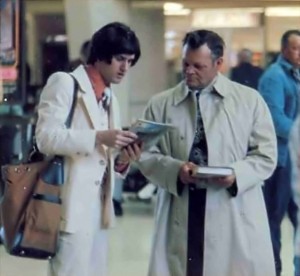 ISKCON Hare Krishna Book Distributor with wig selling books in airport - 1977