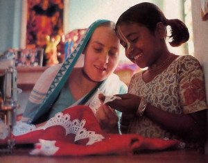 Sewing clothes for the Deities is the way some of the community members (as above) take pleasure in serving the Lord.