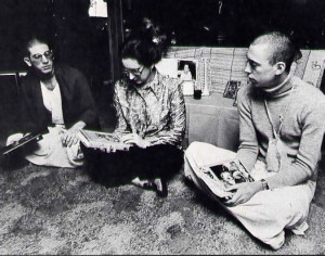 Mrs. Redfield sits in her living room in Boise with her son Jagannatha Puri dasa (at left) and his friend Jyotindra dasa.