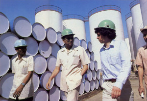 While inspecting his Trombay oil refinery, at left, Nathji explains plant facilities to a visitor.