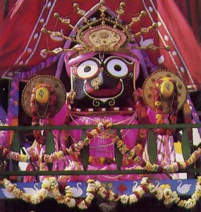 Lord Jagannatha, the center of worship, beams from the main chariot in a recent festival in Boston.