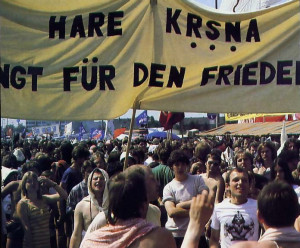 "Hare Krsna Sings for Peace" amid a crowd of marchers in Bonn during President Reagan's visit