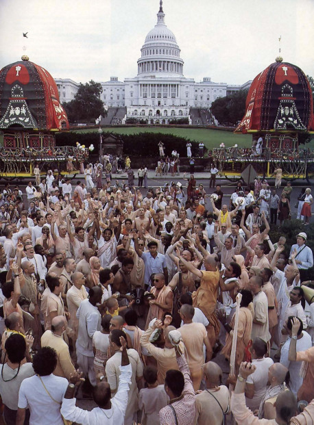 one of the leaders of the Hare Krsna movement (His Holiness Prabhupada-krpa Goswami, at center with sunglasses) leads the devotees in a crescendo of chanting before the Capitol.