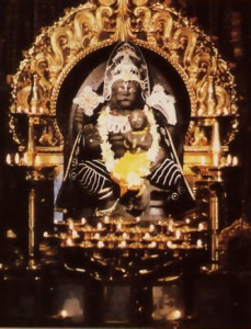 The Deity of Nrsimhadeva. Lord Krsna's form as half-man, half-lion, sits triumphantly on His throne in the Hare Krsna temple in West Germany's Bavarian Forest.