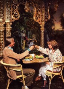 Two patrons toast each other's health with apple juice. The ornate columns and arches, as well as the mural depicting Krsna in the spiritual world, are all products of the devotees' own artistry