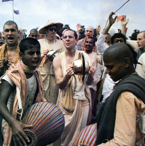 The sound of mrdanga drums and hand cymbals fills the air as devotees from East and West join Srila Ramesvara Swami (center) and Srila Harikesa Swami (with hat), two of ISKCON's present spiritual masters, in a joyous kirtana.