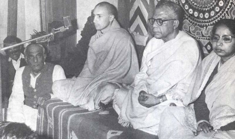 Sriman Acyutananda das Brahmacari, pictured at microphone, is now visiting Calcutta. We have there a every enthusiastic friend for preaching Krsna consciousness: Mr. B.K. Ghosh, M.A., LL.B., who is a great admirer of Caitanya philosophy, and is holding sankirtana meetings every Sunday in different places throughout Calcutta and suburbs. Recently at one meeting, Acyutananda was guest speaker on Krsna consciousness philosophy. Presiding was the Honorable Mr. P.B. Mukherjee, Justice of the Calcutta High Court, sitting to the left of Acyutananda. Gradually this nice center of the International Society for Krishna Consciousness is growing, with the prospect of headquaters at Mayapur, the birthsite of Lord Caitanya.