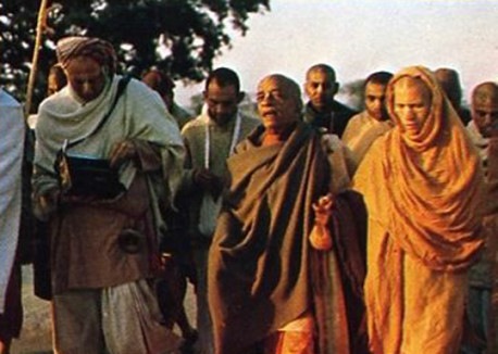 Srila Prabhupada leads disciples on an early morning walk in this transcendental land.