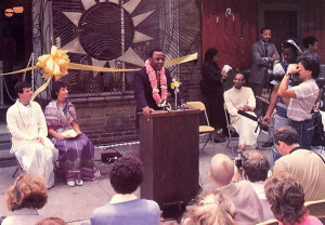 Mayor W. Wilson Goode addresses a gathering at the grand opening of Philadelphia' s new Hare Krishna Food for Life center. Rapa-manohara dasa and Candrika-devi dasi (seated at left), codirectors of the center, and Sesa dasa (seated at right), president of Philadelphia ISKCON, participated in the ceremony.