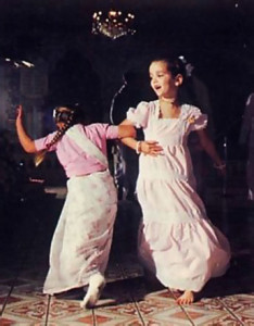 Two young devotees enthusiastically join in the congregational chanting and dancing
