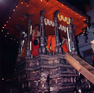 Then the Deity is carried to His throne on a silver chariot. The evening parades last about two hours, and residents and pilgrims alike turn out to sec the Lord riding high upon His cart.