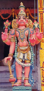 A gatekeeper to Vaikultha, the spiritual kingdom of God, stands watch over an entrance to the temple.