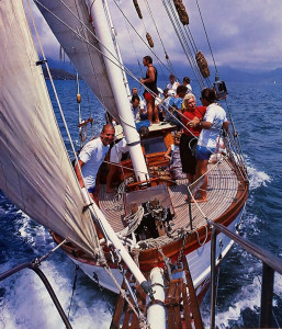 The Jaladuta II keels to starboard under a strong wind as she sails along the southern shore of Oahu