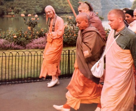 Srila Prabhupada walking with disciples in London, England, 1974.