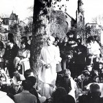 Srila Prabhupada standing under a tree and preaching Krishna consciousness in Tompkins Square Park New York City, 1966.