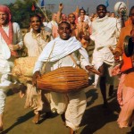 ISKCON devotees from around the world hold sankirtan, congregational chanting of Hare Krishna, in Mayapur, India, the birthplace of Lord Caitanya Mahaprabhu. 1974.