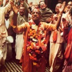 Srila Prabhupada dances in front of the Deities, Sri Sri Radha Gokulananda, at Bhaktivedanta Manor near London. 1974.