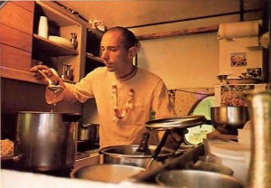 Visnujana Swami cooking for Krishna in the kitchen of the traveling party's bus. 1974.