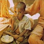 Hare Krishna devotee feed villagers prasadam Mayapur in West Bengal, India, 1974.