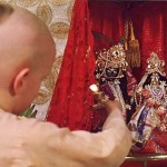 Dvlirakadhisa dasa offers a lamp to Krishna. ISKCON Gurukula Dallas Texas 1975.