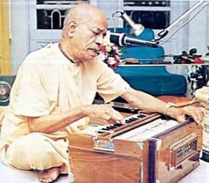 Srila Prabhupada playing Harmonium. 1975.