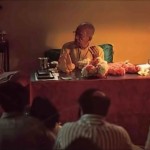 Srila Prabhupada with guests and discipels for evening study session. 1975.