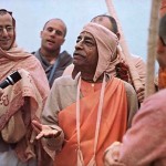 Disciples gather around His Divine Grace at Venice Beach in Los Angeles to hear their guru 's timeless teachings.