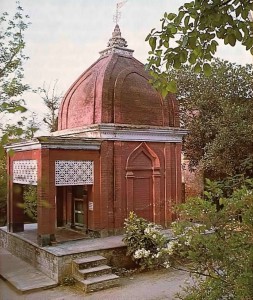 Classic red sandstone tomb of Srila Bhaktivinoda Thakura rests peacefully amidst the palms on the banks of the Jalangi. 1976.
