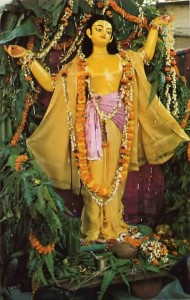 Lord Caitanya Deity poses gracefully during Benares festival commemorating His appearance.