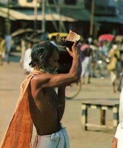 The bearded brahman carries on his head a "halfpot" of rice.- Jagannatha Puri  1976