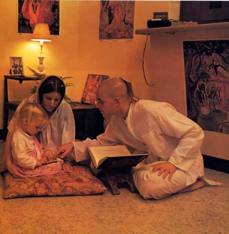 Hare Krishna Devotee with wife and daughter read Bhagavad Gita 1976