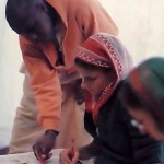 Howard Sewell (Haravapu dasa) points out a drawing technique to Sandra Griffis (Saiijaya-devi dasi), an art graduate from Goddard College. - 1977