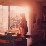 an artist meditates on the Hare Krishna mahamantra before he begins a day of painting.