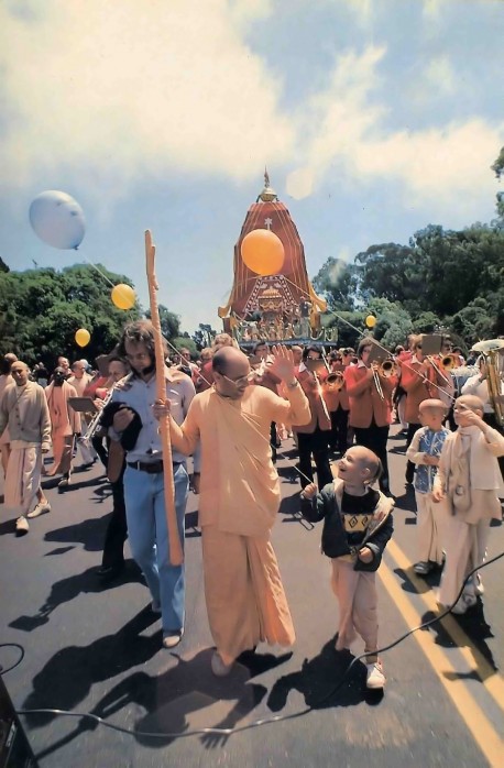 With the band playing a Hare Krishna march (horns and drums to the tune of the maha-mantra), the chariots roll through Golden Gate Park. - 1977