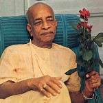 In his quarters, Srila Prabhupada accepts a flower from a disciple. 1977