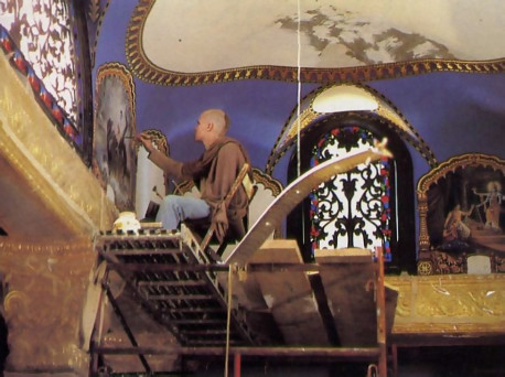 A painting of Lord Krsna's pastimes receives details on the ceiling of the Hare Krsna palace in West Virginia.