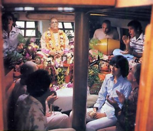 Devotees and friends chant Hare Krsna in the boat's temple cabin .