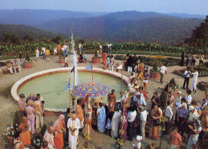 Devotees and guests mingle by a fountain in the Palace gardens. Srila Bhaktipada, spiritual leader of New Vrindaban, explains that with the Palace New Vrindaban has begun to reveal itself as "a place of pilgrimage in the Western world, a place where people can come and see spiritual life in action."