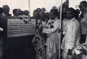 His Holiness Gopala-Krsna Goswami (center. wearing garland and g asses), who oversees the affairs of the Hare Krsna movement in western India, lays the cornerstone of a cultural center the movement is constructing in Baroda. near Bomhay.
