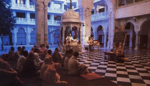 A place of varied spiritual moods. In the early morning devotees gather in the main temple for a class in Vedic philosophy. I n the small pavilion at the back sits an image of Srila Prabhupada. who established Hare Krsna Land. Behind him is the temple's open  courtyard.