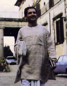Dressed in traditional clothes and carrying prayer beads, Marco sets off to inspect renovation work on the Krsna farm near Florence